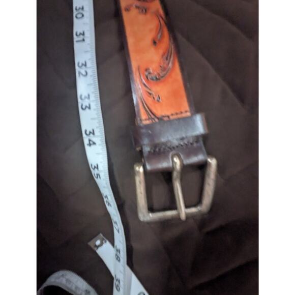 Women\'s light tan tooled leather belt w/silver hardware by Express size M (34\